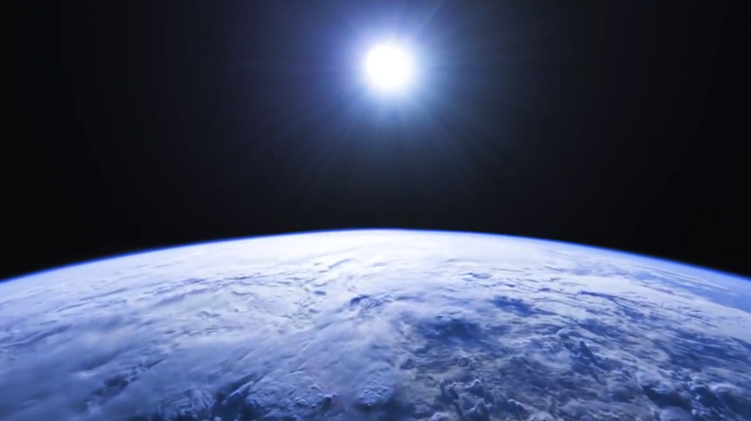 Earth viewed from space with the sun in the background.